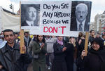 People carry banner with pictures of Ariel Sharon and Adolf Hitler during an anti-Israeli demonstration in central Amsterdam, Saturday, April 13, 2002. Thousands gathered to protest Israel's military actions in the West Bank. (AP Photo/Dusan Vranic) 